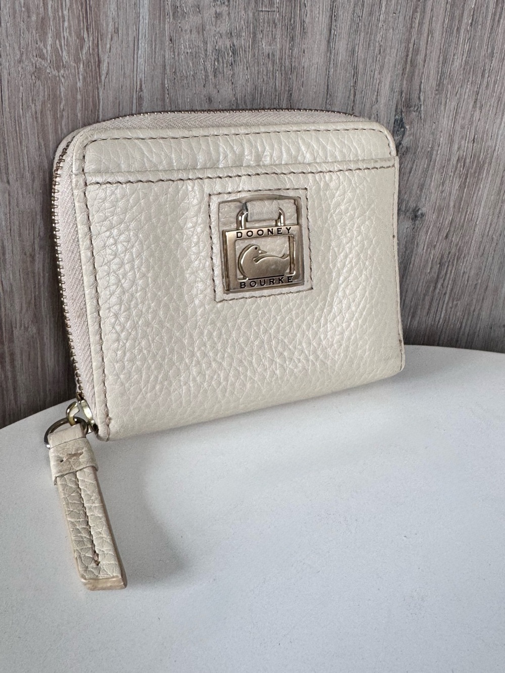 Dooney & Bourke Cream Pebbled Leather Zip Wallet with Logo Plaque